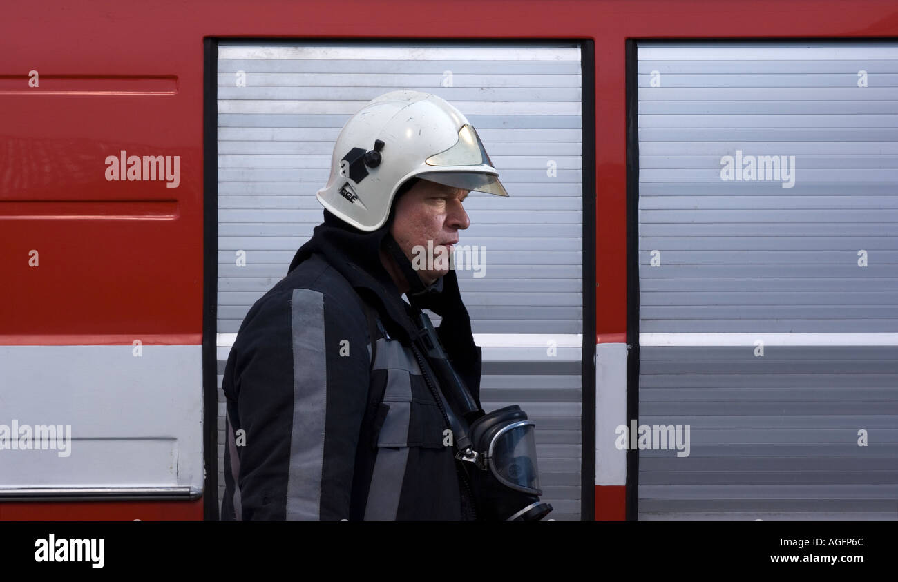 Fireman in front of fire truck Stock Photo - Alamy