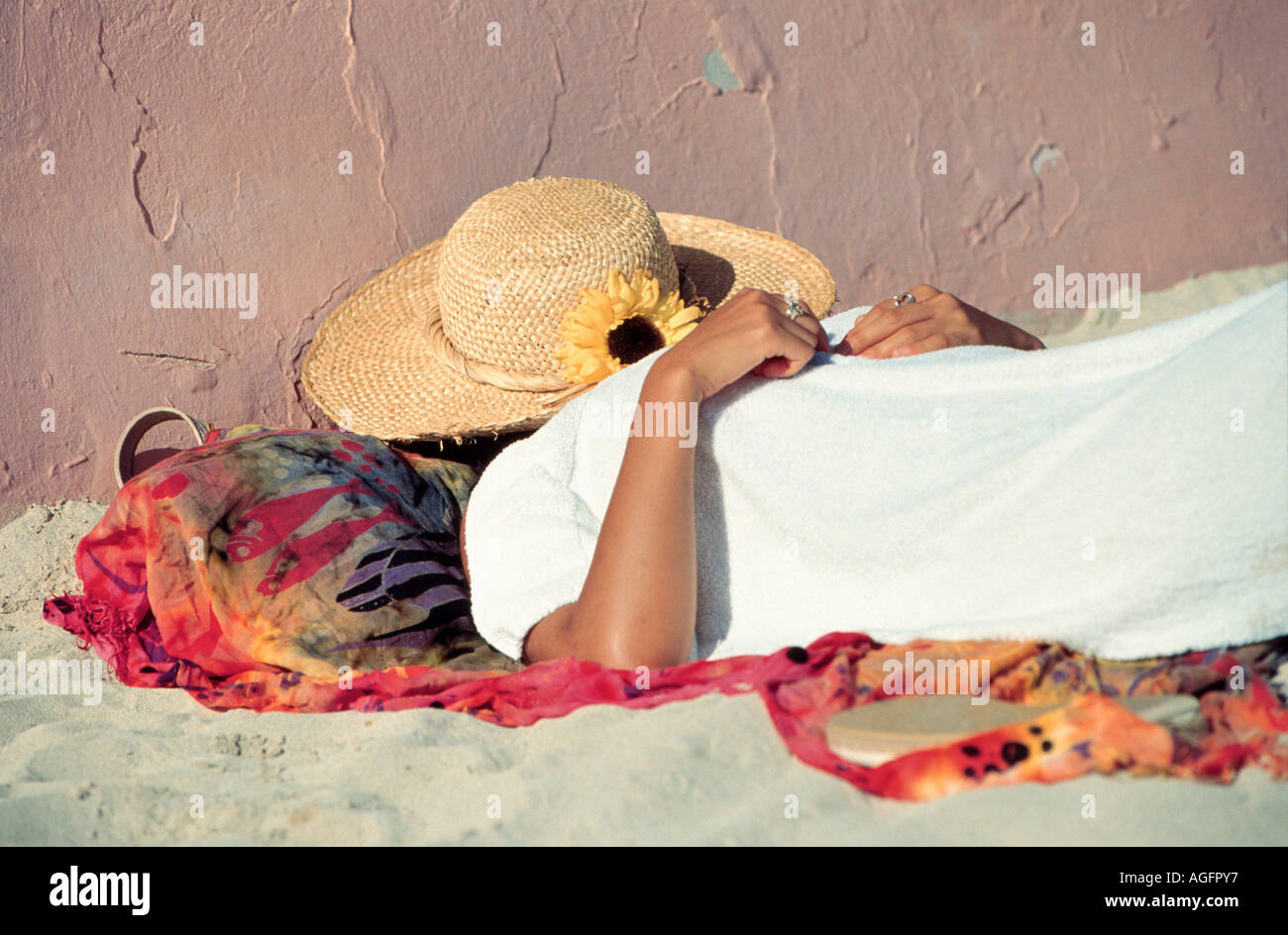 woman sleeping under straw hat on beach, Hawaii, USA Stock Photo - Alamy