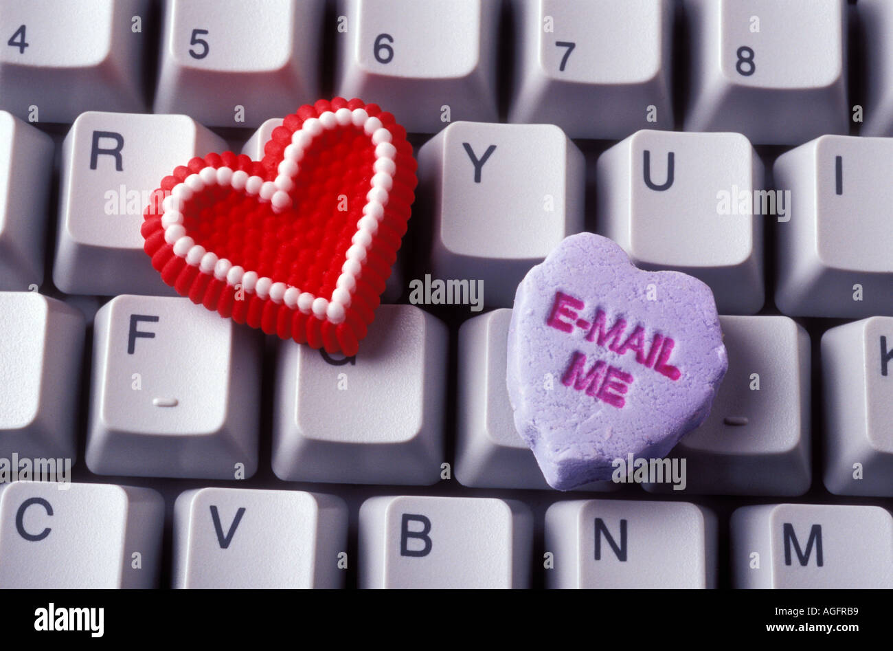Candy hearts on computer keyboard Stock Photo Alamy