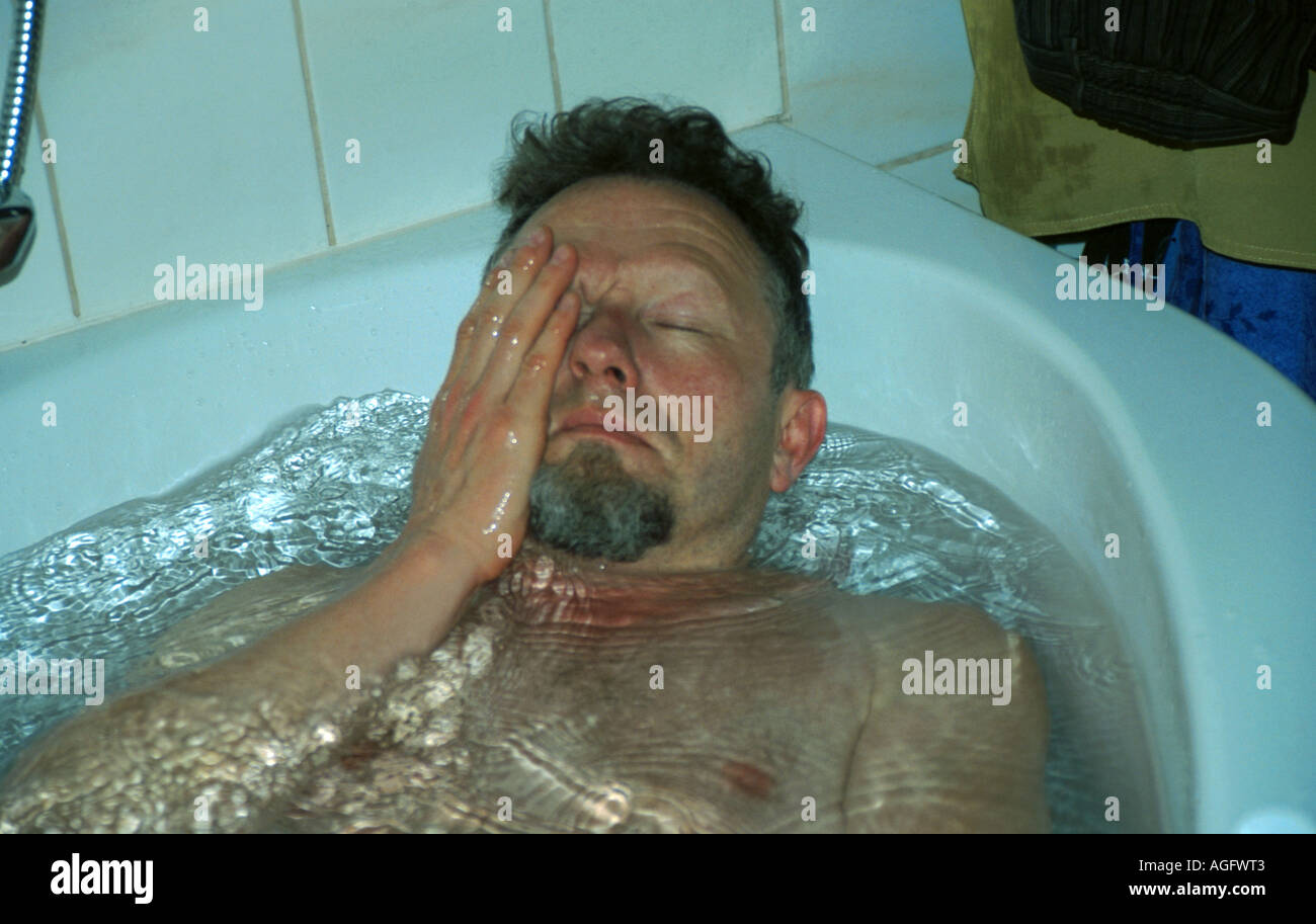 tired man in bath-tub, Austria, Bad Ischl Stock Photo - Alamy