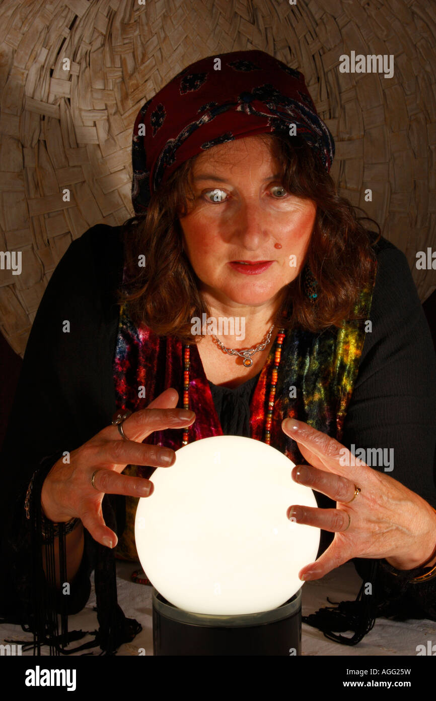 Fortune Teller staring at a crystal ball Stock Photo Alamy