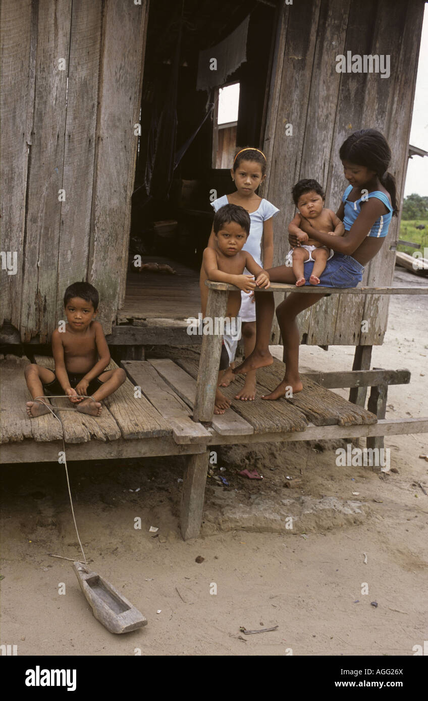 Brazil Amazonia 2005. Family life Children playing on verandah of thatched home Stock Photo