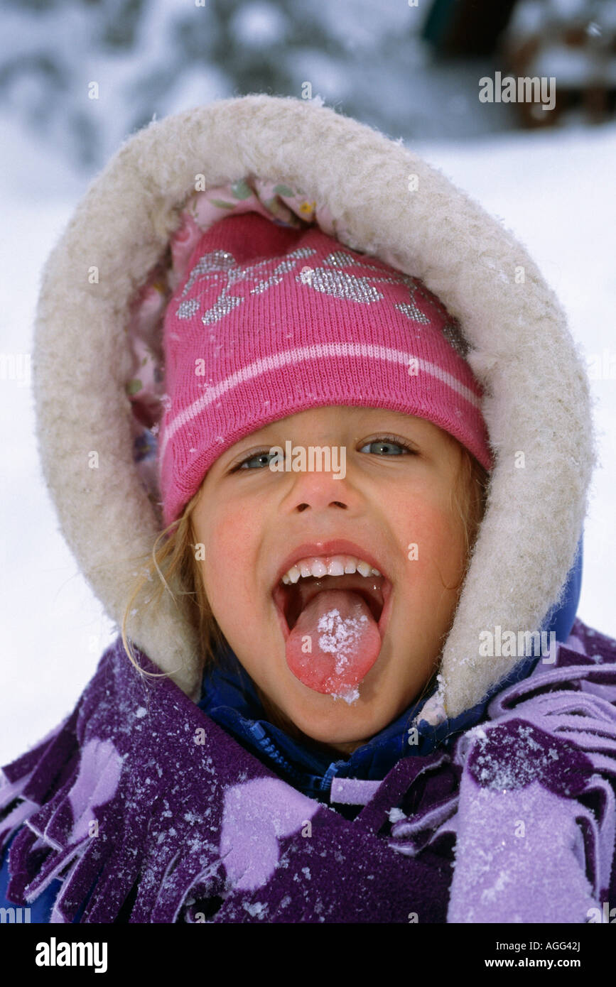 Young Girl Catching Snowflakes on Tongue SC AK Winter Stock Photo - Alamy