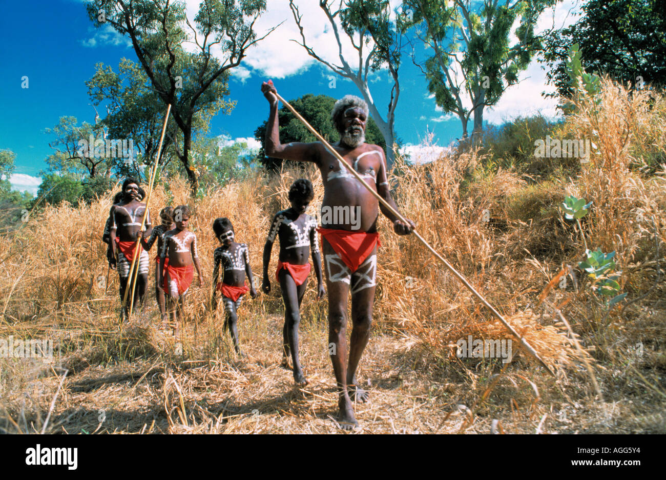 a family of aboriginals strolling in the wild, near Darwin, Australia Stock Photo