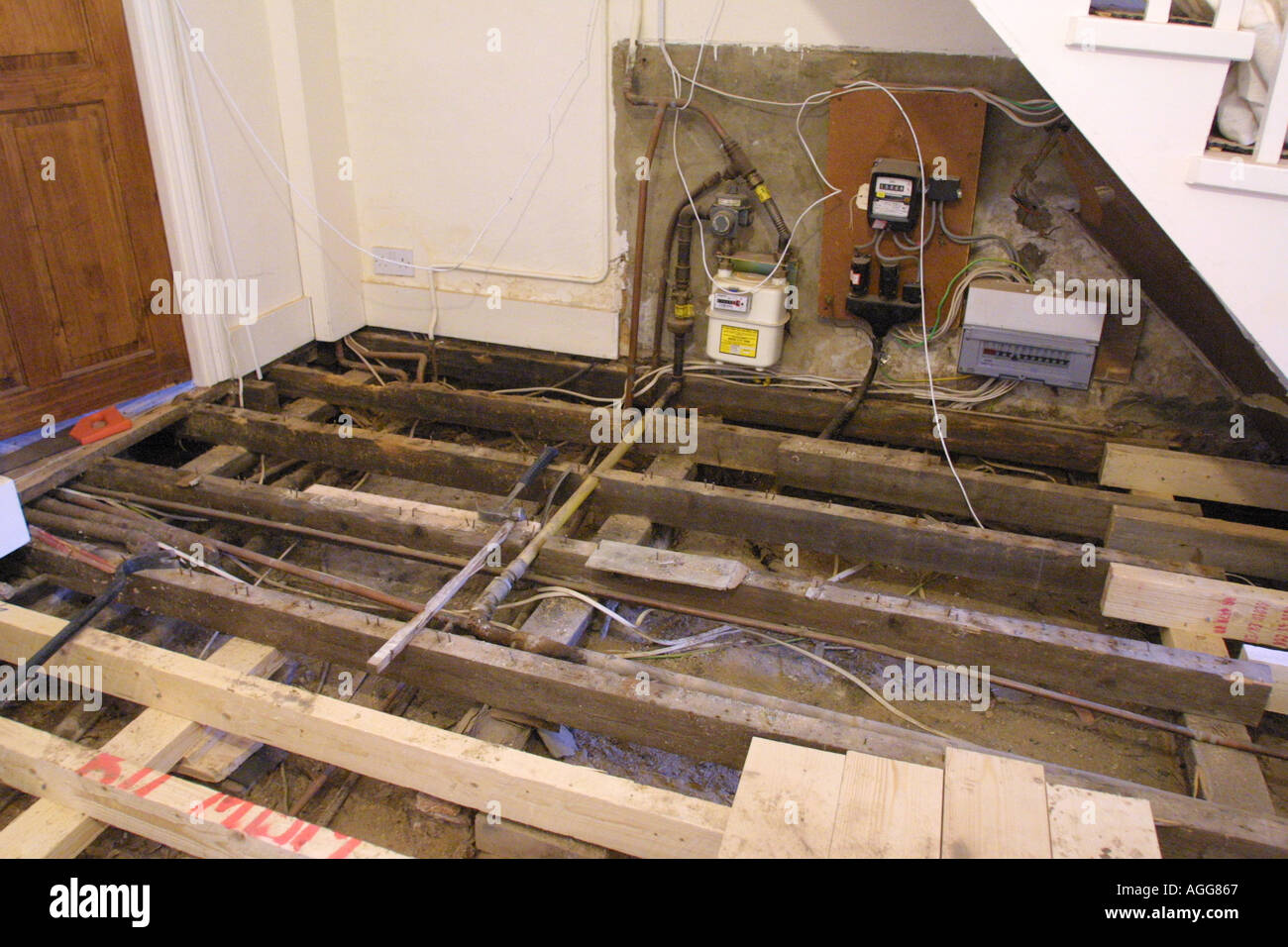 House repairs and new floor boards after finding damp and dry rot Stock