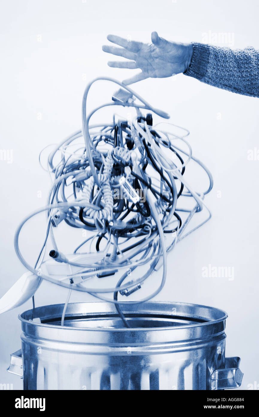 Dropping computer cords into trash Stock Photo Alamy