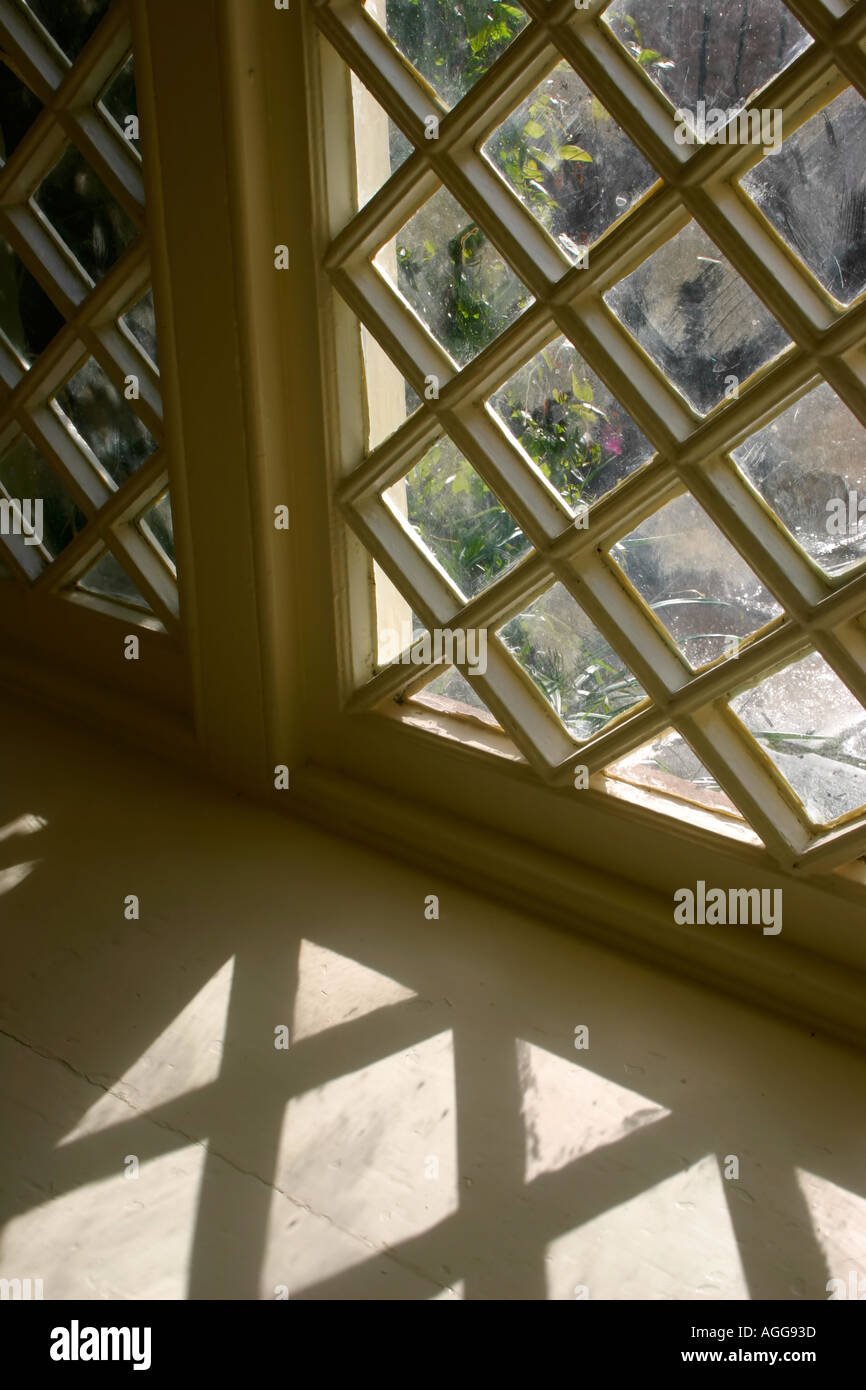 Window with shadow from diamond shaped panes Stock Photo