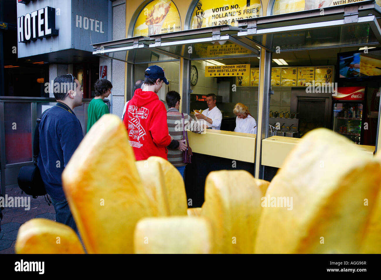 People standing in line for a cone of french fries Amsterdam Holland