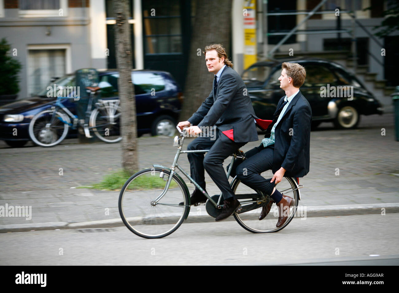 People riding bicycle Amsterdam Holland Stock Photo Alamy