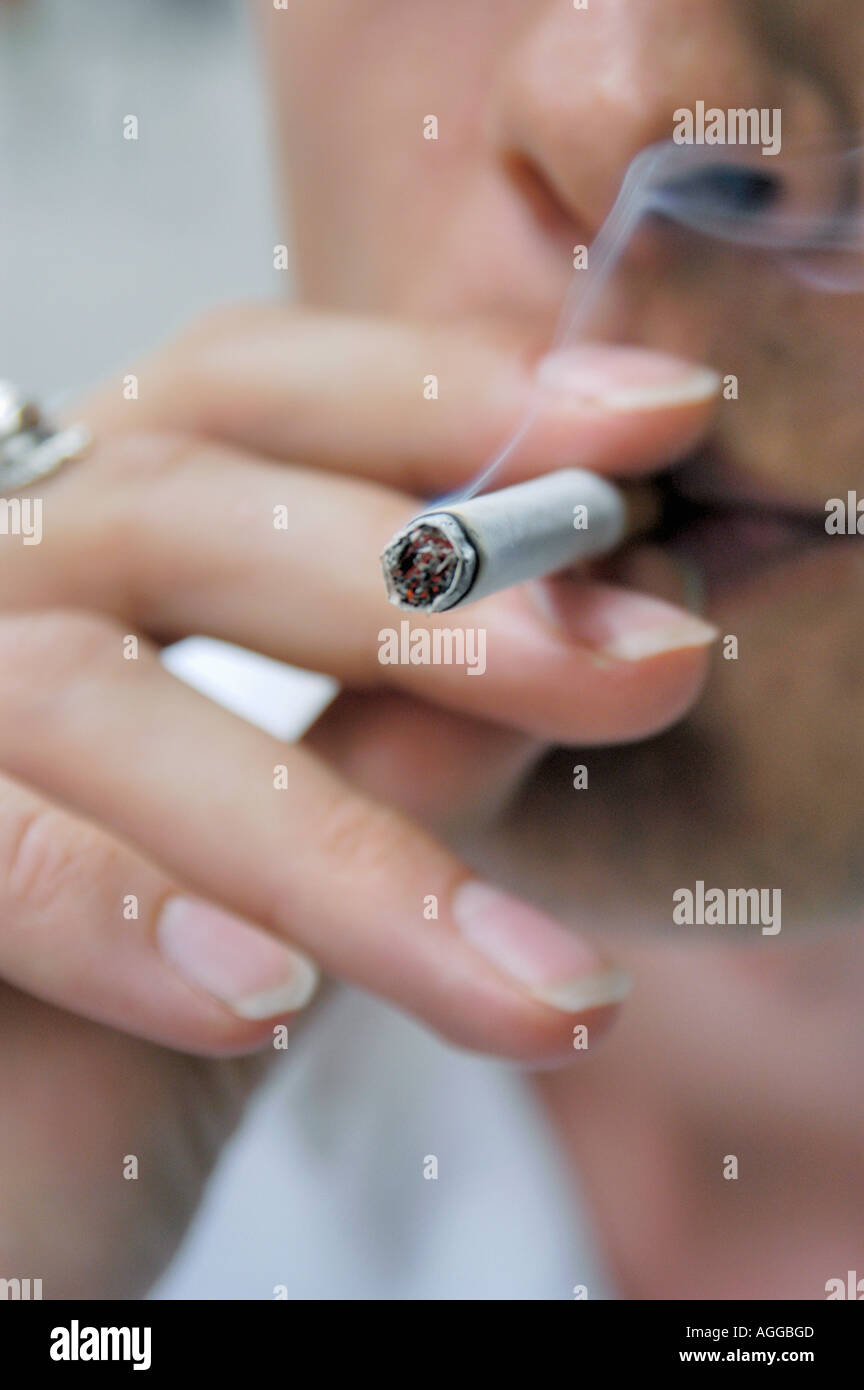 smoker inhaling the fumes Stock Photo