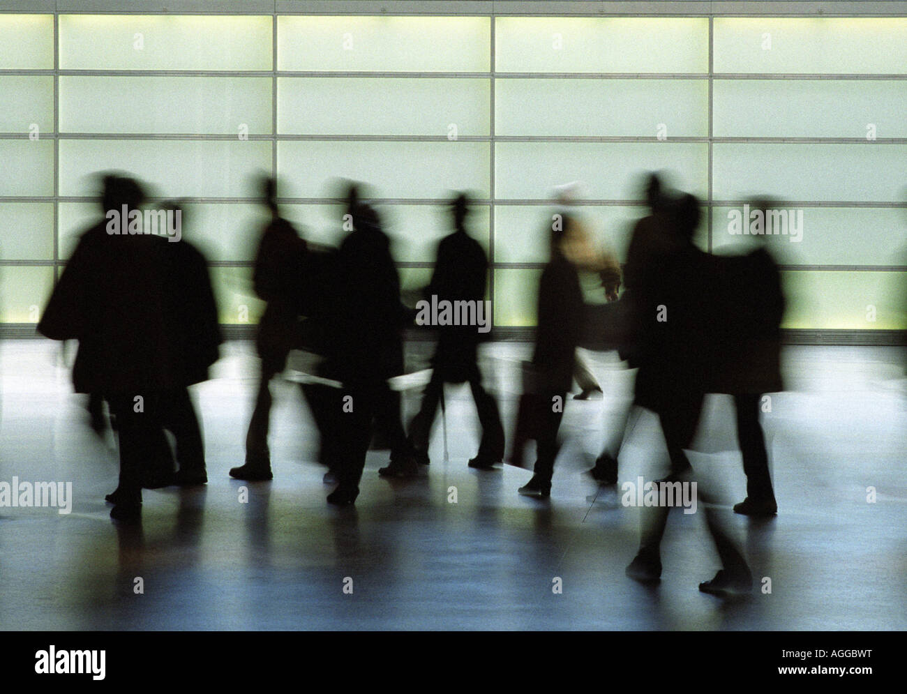 Silhouettes of walking people Stock Photo
