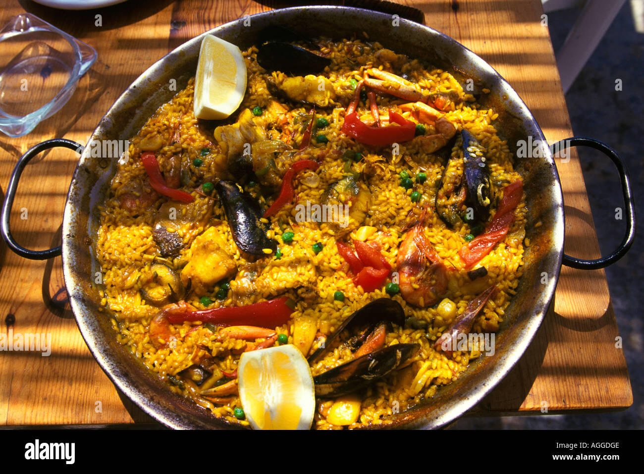 Paella at the restaurant on the beach on Playa Cala D Hort Stock Photo