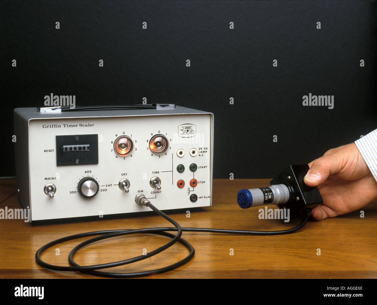 A scaler and a geiger tube being used to measure radioactive background count Stock Photo