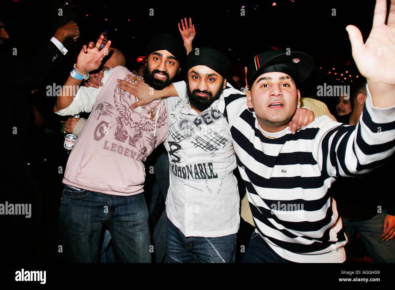 Group of Asian guys dancing at Desi Jam at Eros nightclub in Enfield Stock Photo