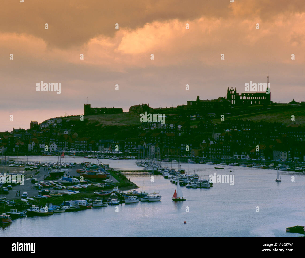 View over the harbour and River Esk to the Abbey ruins, Whitby, North Yorkshire, England, UK Stock Photo