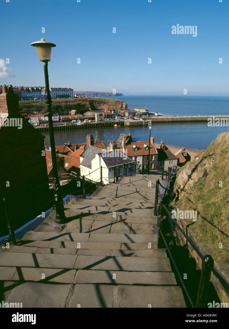 Looking down the East Cliff's flight of 199 steps, with harbour and North Sea beyond, Whitby, North Yorkshire, England, UK Stock Photo