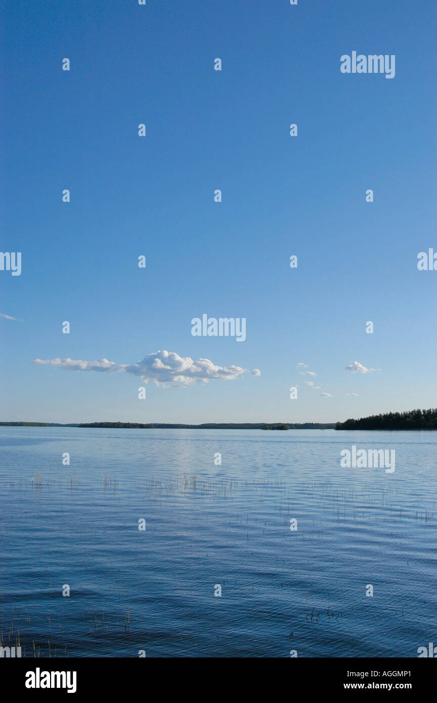 clear blue sky over calm lake, Sweden Stock Photo