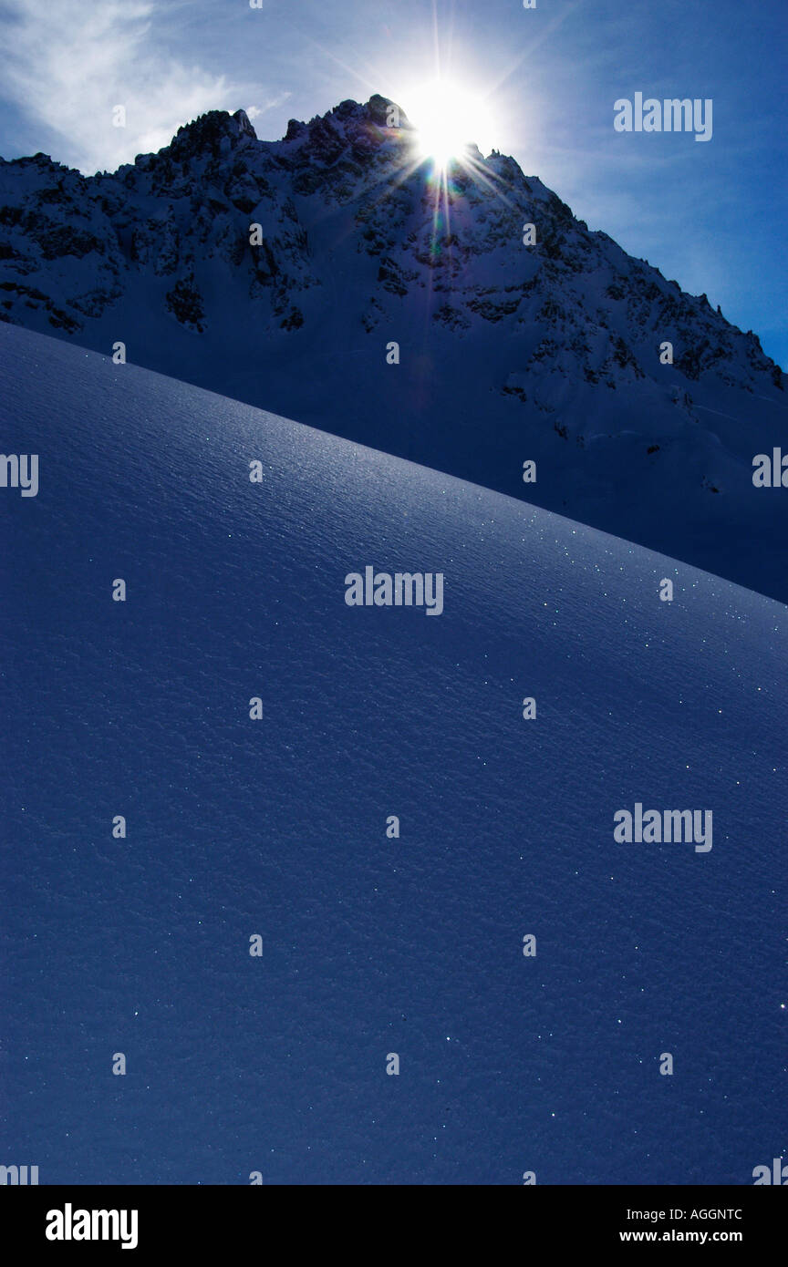 mountain top and valley with glistening snowflakes, Val Thorens, French Alps, France Stock Photo