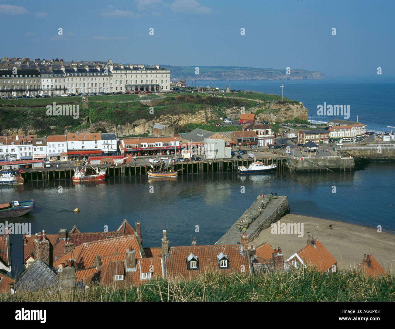 View over Harbour to the West Cliff, with the North Sea beyond, from St Mary's Church, Whitby, North Yorkshire, England, UK Stock Photo