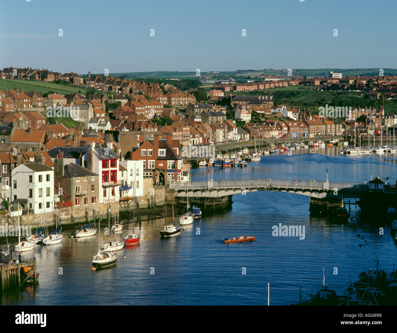 View over the Swing Bridge over River Esk (1908), to the inner harbour, Whitby, North Yorkshire, England, UK Stock Photo