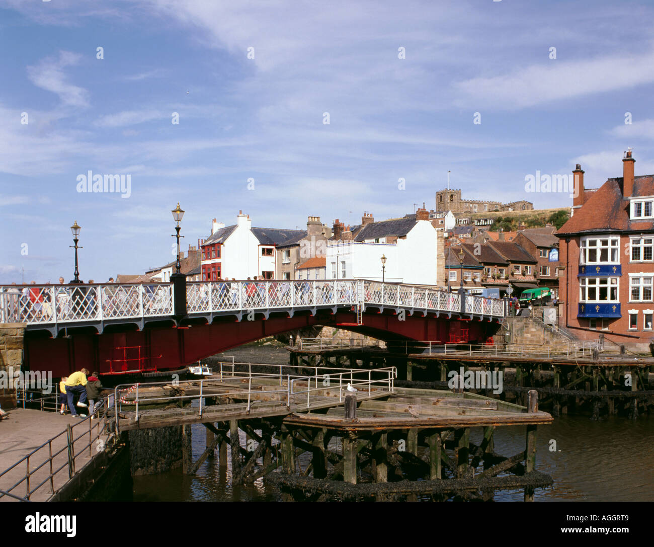 Swing Bridge over River Esk (1908), with St Mary's Church on the skyline beyond, Whitby, North Yorkshire, England, UK Stock Photo