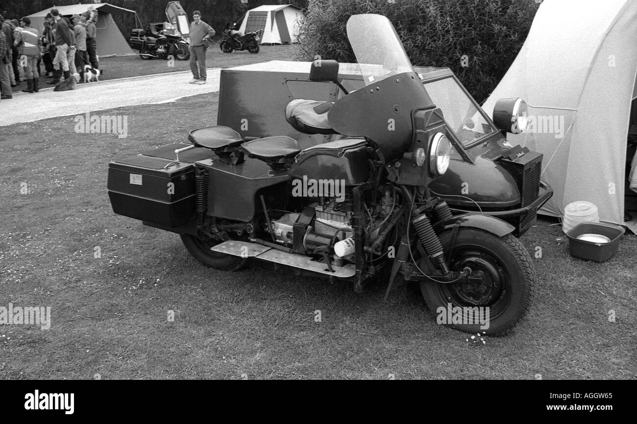 Old motor cycle and home made sidecar parked adjacent to a tent at Skipsea in North Yorkshire Stock Photo