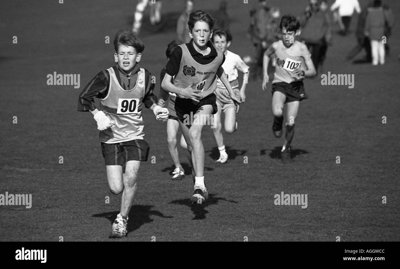 boy-cross-country-runner-with-others-following-under-stress-at-the-end