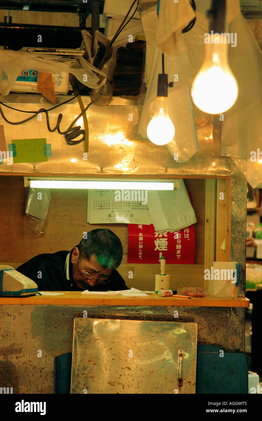 vendor behind counter, Fish Market, Tokyo, Japan Stock Photo