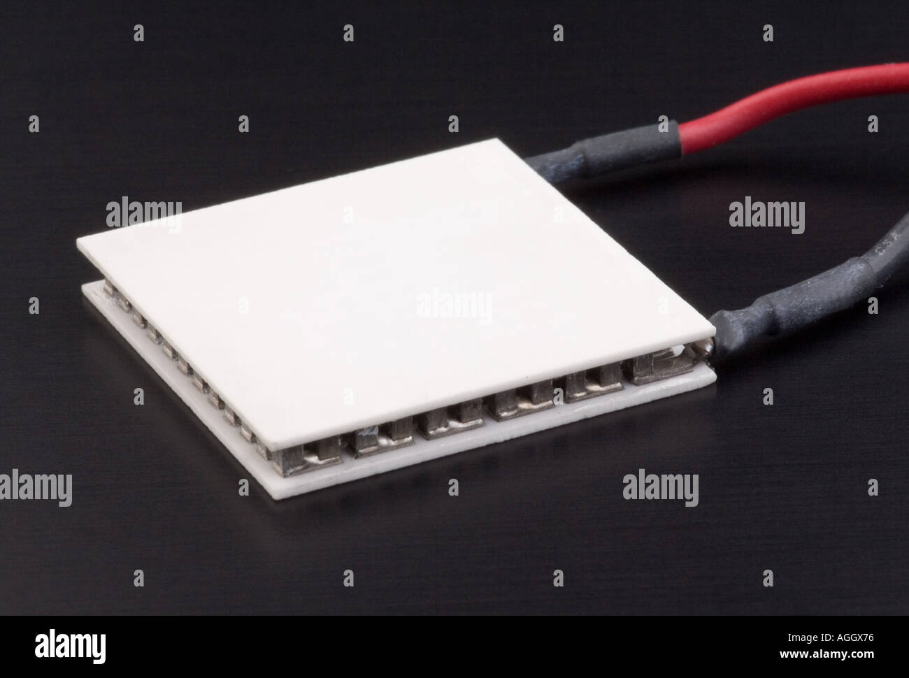 A thermoelectric cooling device that operates using the Peltier effect when current is passed through one side gets cold and th Stock Photo