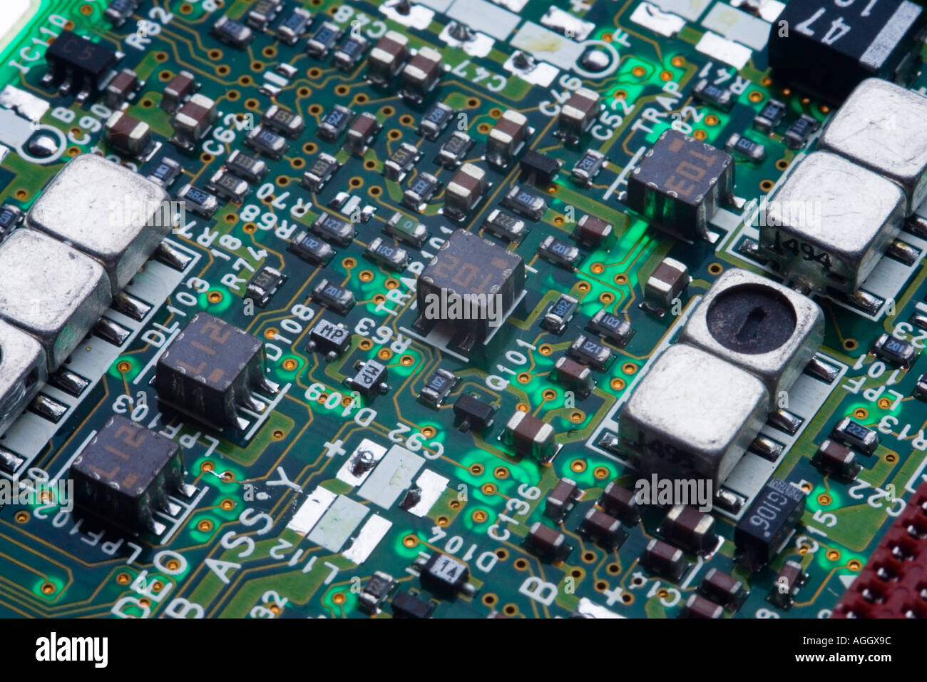 A circuit board showing various electronic components the construction is surface mount technology looking like a crowded city Stock Photo