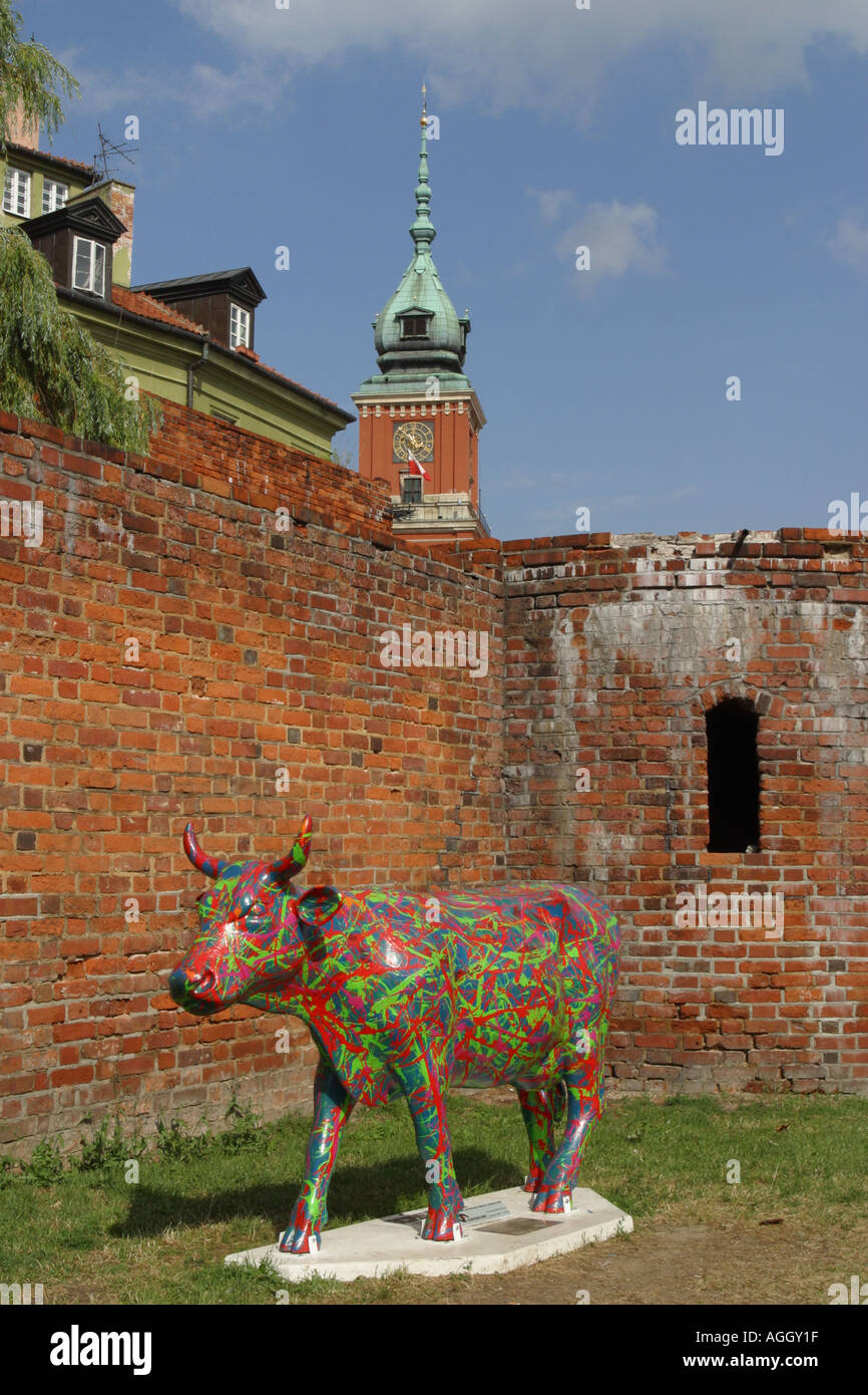 Warsaw Old Town Poland Modern Art Cow stands alongside the old town walls taken Summer 2005 Stock Photo