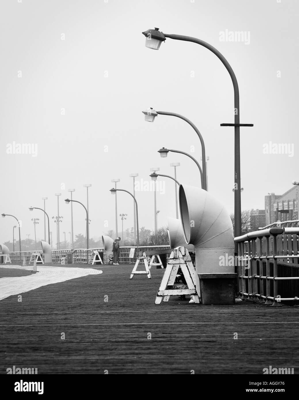 Jones Beach state park boardwalk with lampposts in black white Stock Photo