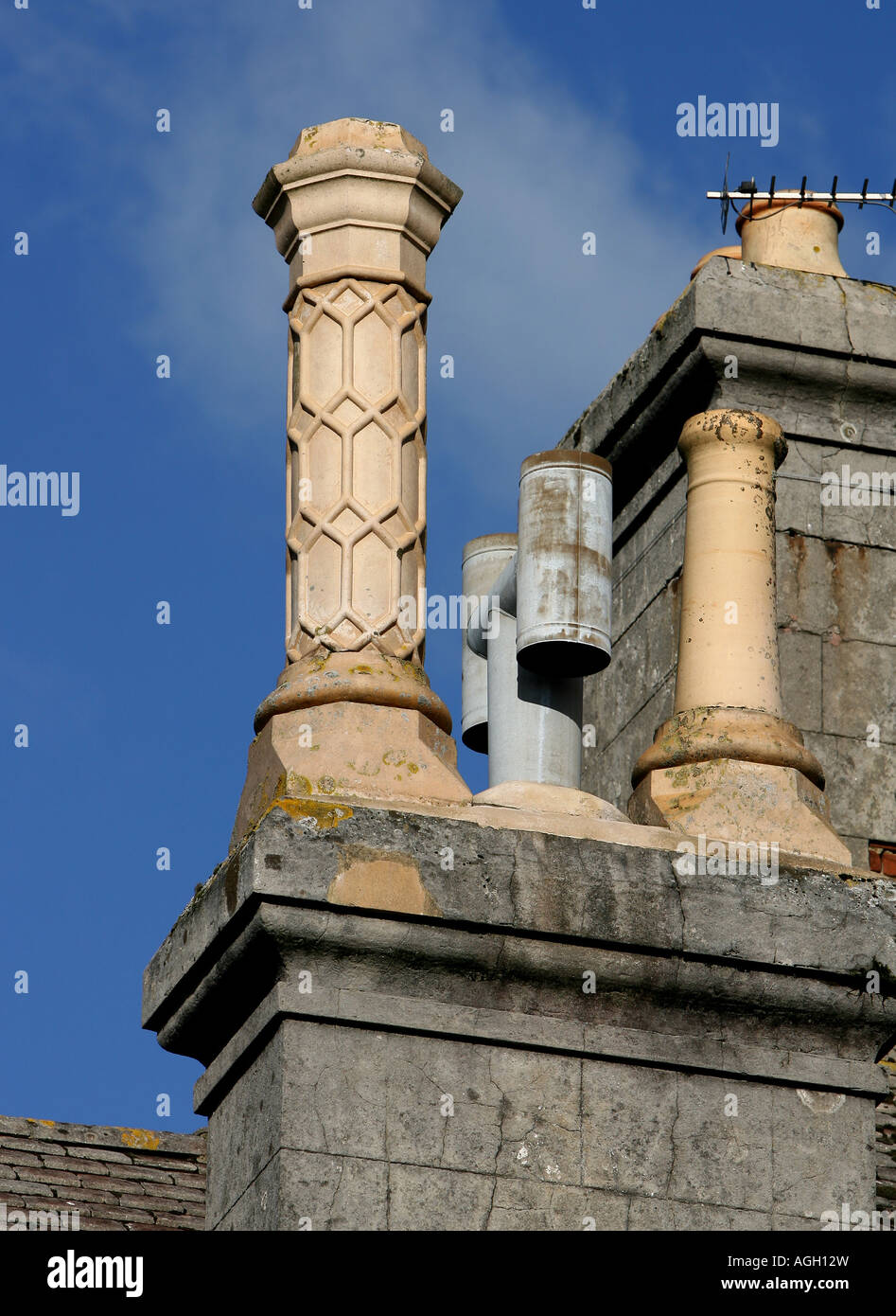 ornate patterned chimney against blue sky Stock Photo