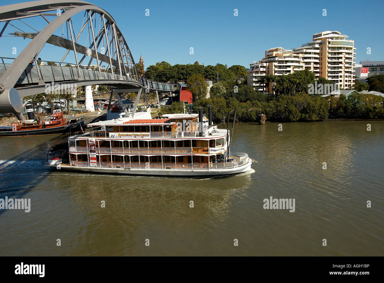 Paddle boat on the Brisbane river passing under the Goodwill bridge