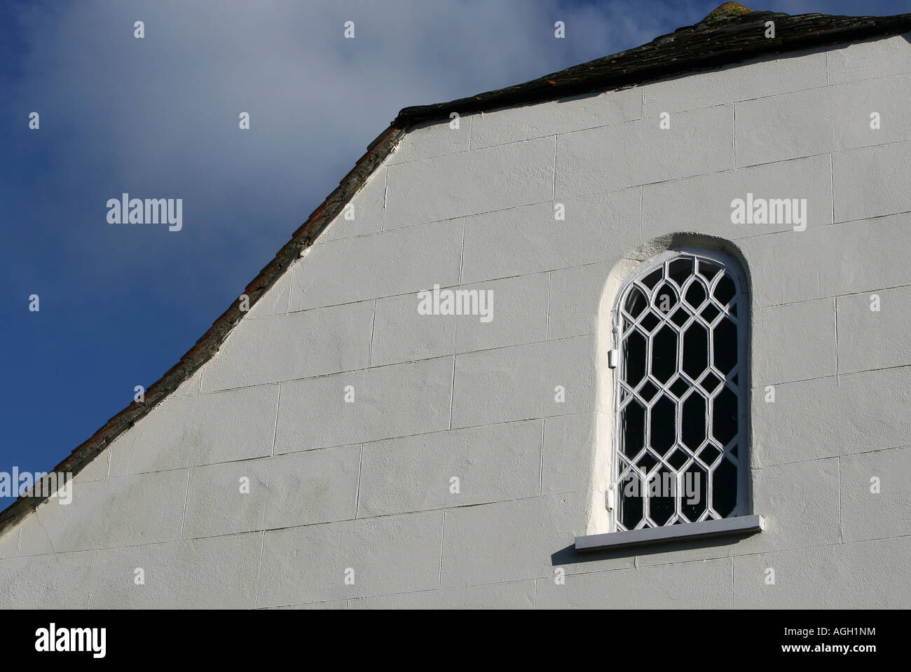old turn of centuary house with ornate window Stock Photo