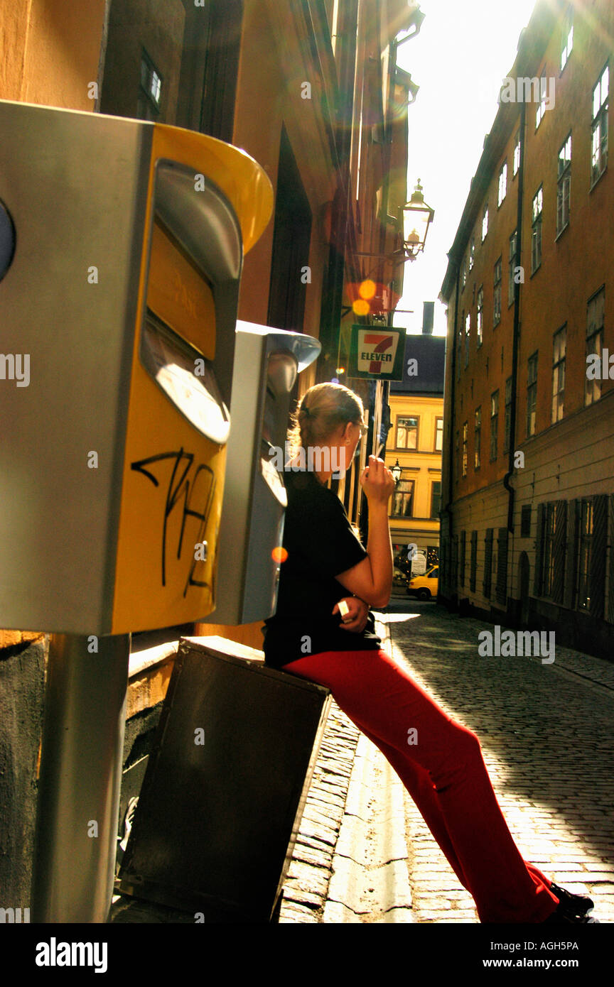 staff taking smoking break outside, Stockholm, Sweden Stock Photo