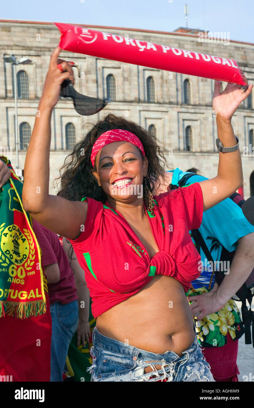 Portugese woman smiles before a soccer game is screened at a Fan  Fest in Germany during  the 2006 World Cup Stock Photo