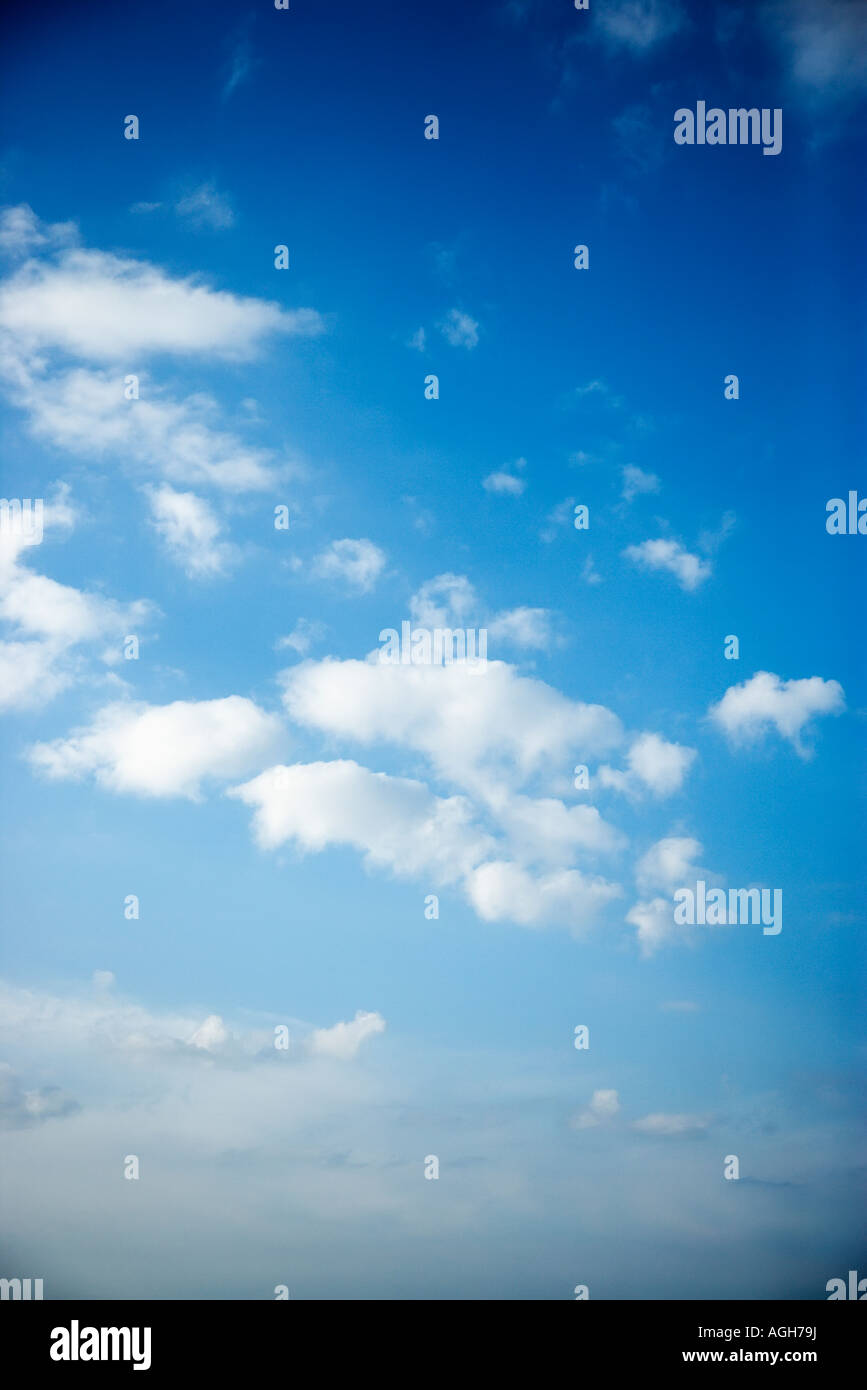 Fluffy cumulus clouds in blue sky Stock Photo - Alamy