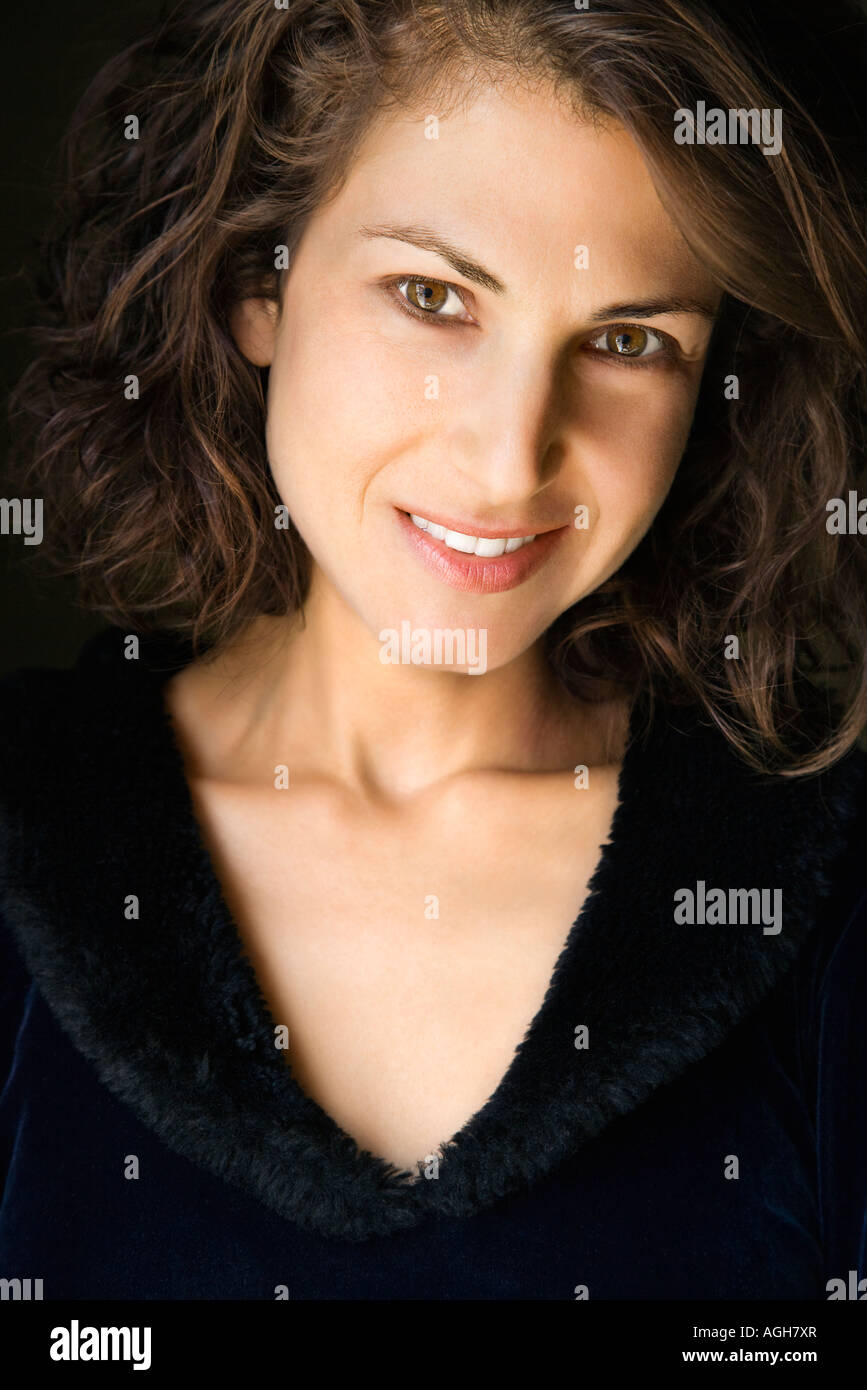 Head and shoulder portrait of pretty brunette woman smiling Stock Photo ...
