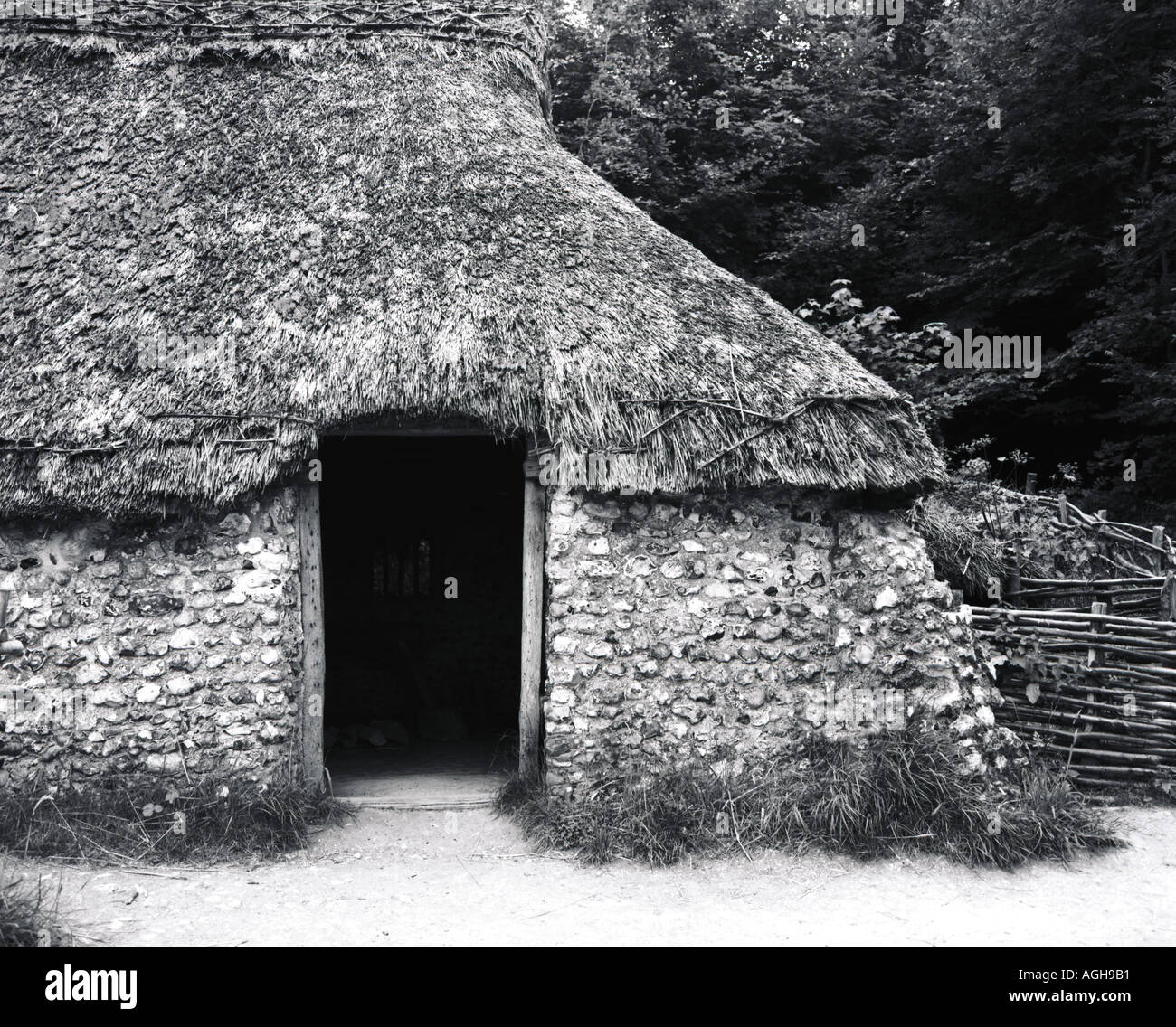 Medieval Grass thatched roof house Stock Photo