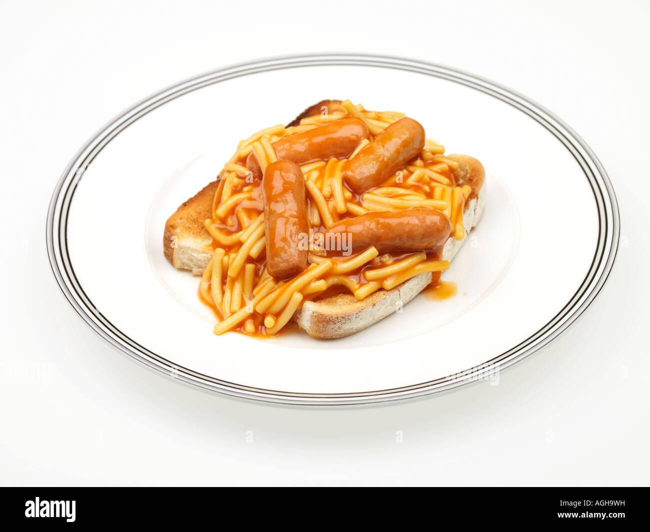 Tin Of Spaghetti Pasta In Tomato Sauce With Pork Sausages On Toast Meal