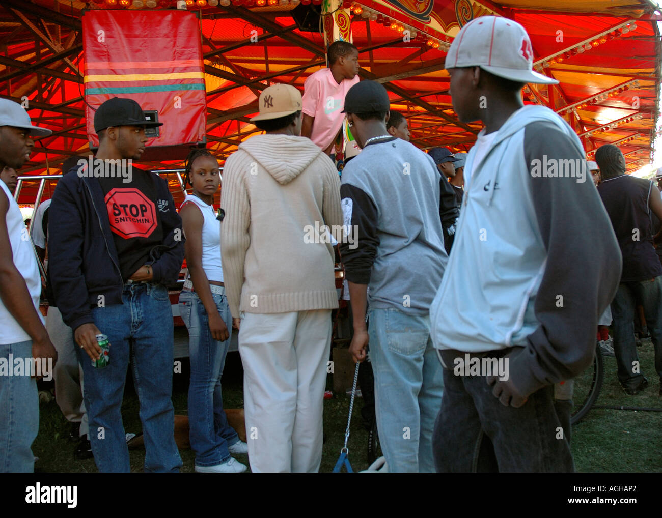 Group of youth hanging around Fun Fair at Lambeth Country Fair in