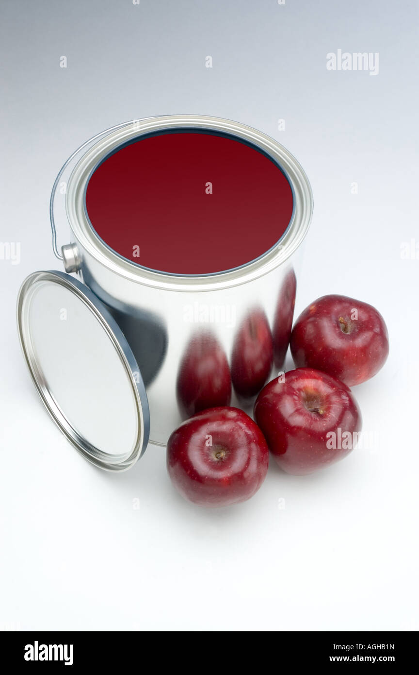 Apples matching the same colour in a paint can Stock Photo Alamy