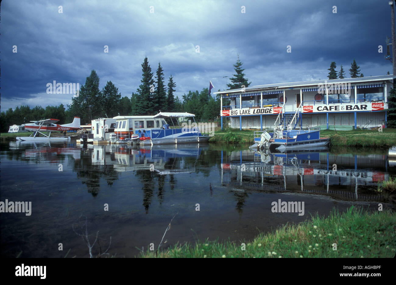 USA Alaska Big Lake Alaska Big Lake Lodge boats and floatplanes at dock ...