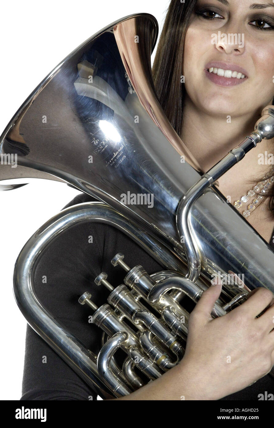College age woman poses with her baritone euphonium Stock Photo