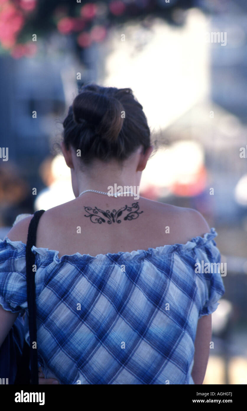 close up of girl s back with tattoo Stock Photo