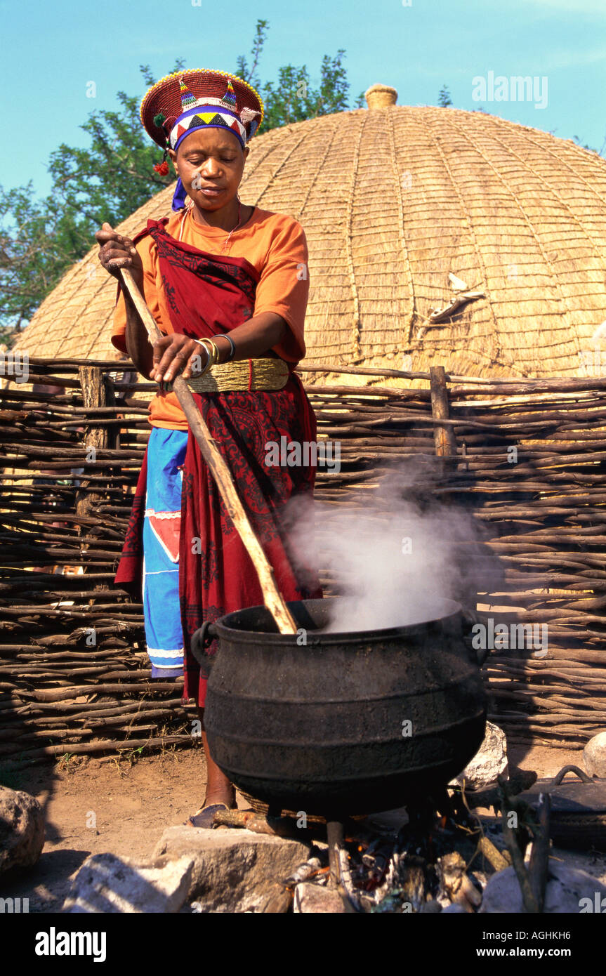 South Africa Simunye Zulu Woman Cooking Stock Photo