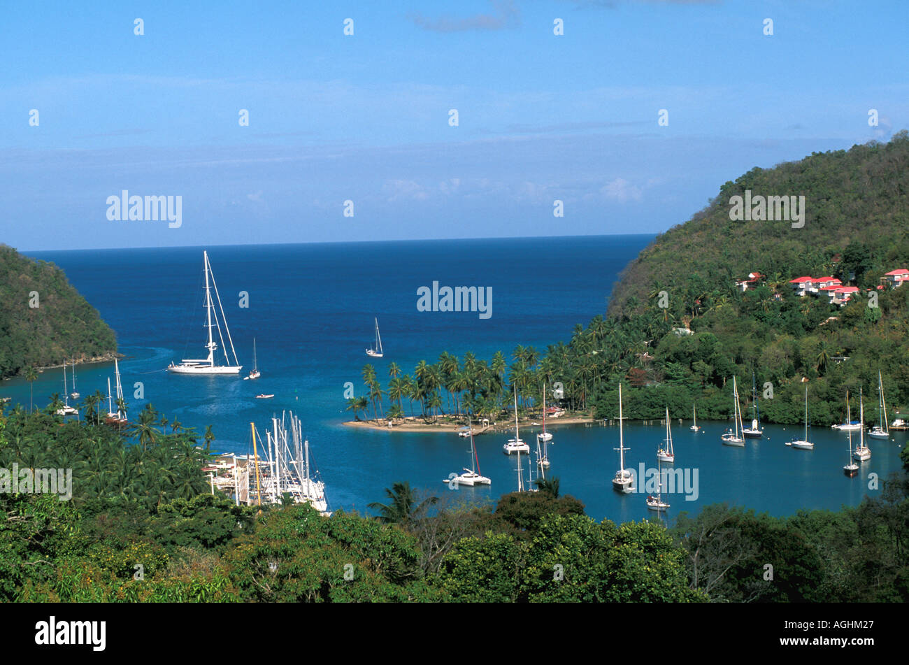 St Lucia Island Caribbean Marigot Bay scenic view coconut palms coastline sailboats beach Stock Photo