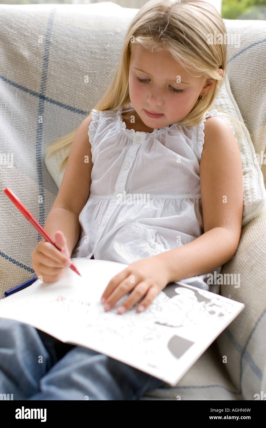 child using an activity book Stock Photo - Alamy