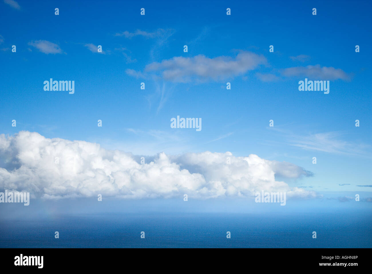 Blue sky with white puffy clouds Stock Photo - Alamy